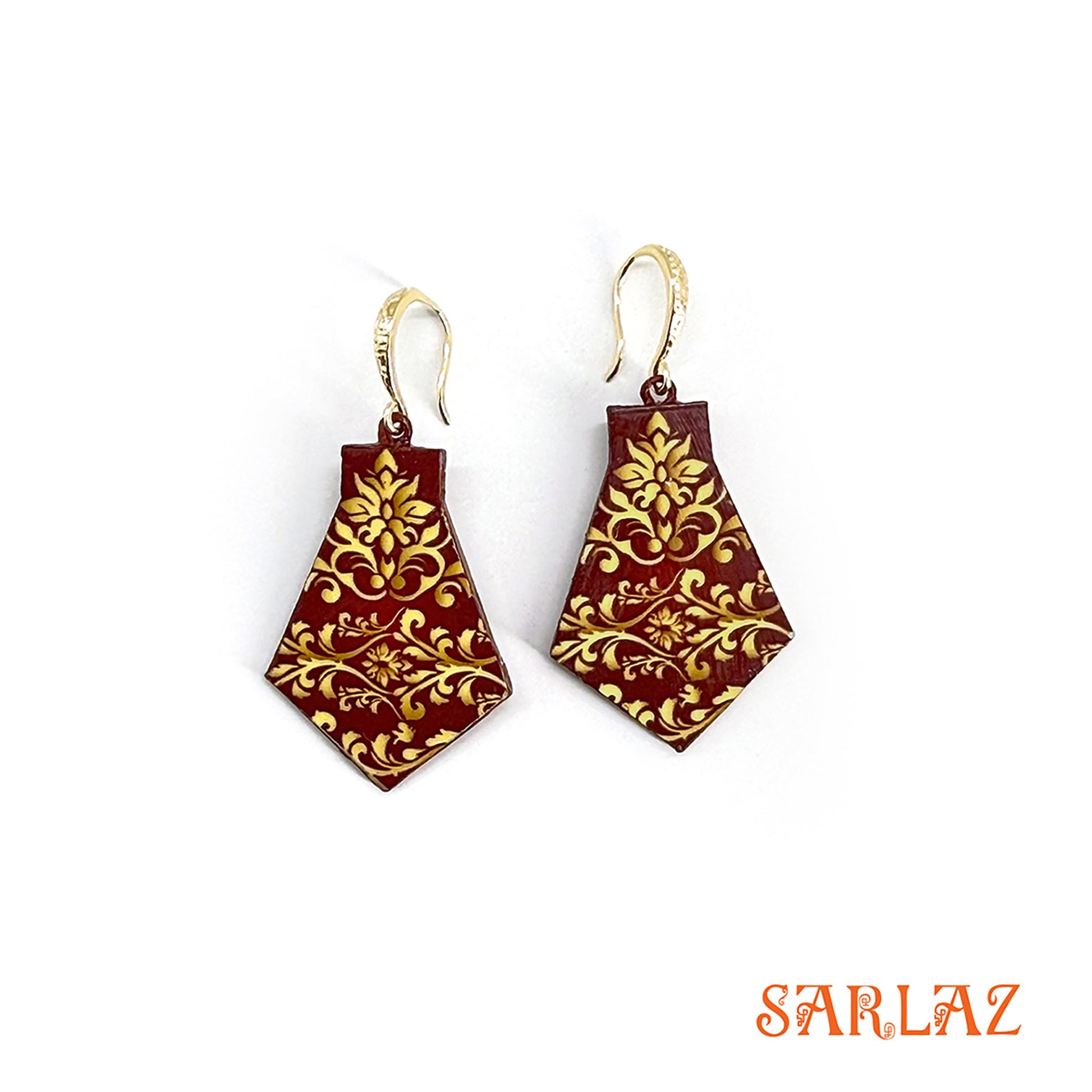 Pair of gold and red earrings with 'SARLAZ' branding on a white background