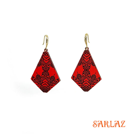 Red earrings with black patterns on a white background, featuring the brand 'SARLAZ'.