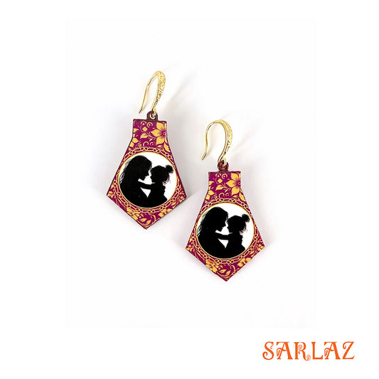Pair of earrings with a floral design and silhouette of a mother and daughter, branded 'SARLAZ'.