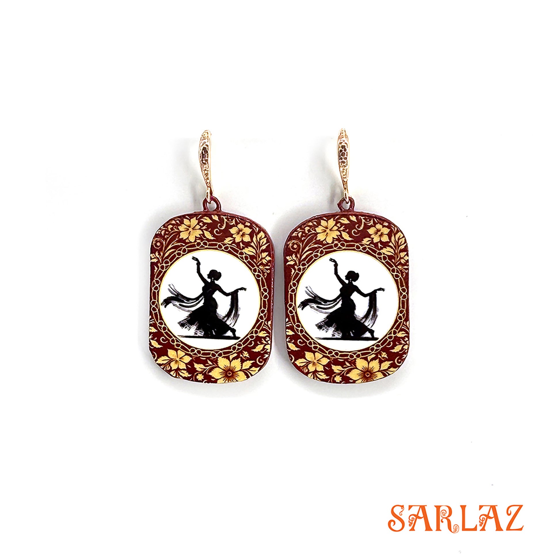 Decorative earrings with floral designs and a silhouette of a dancer on a white background, branded 'SARLAZ'.