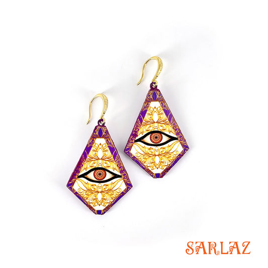 Gold and purple earrings with eye design on a white background, featuring the brand 'SARLAZ'.