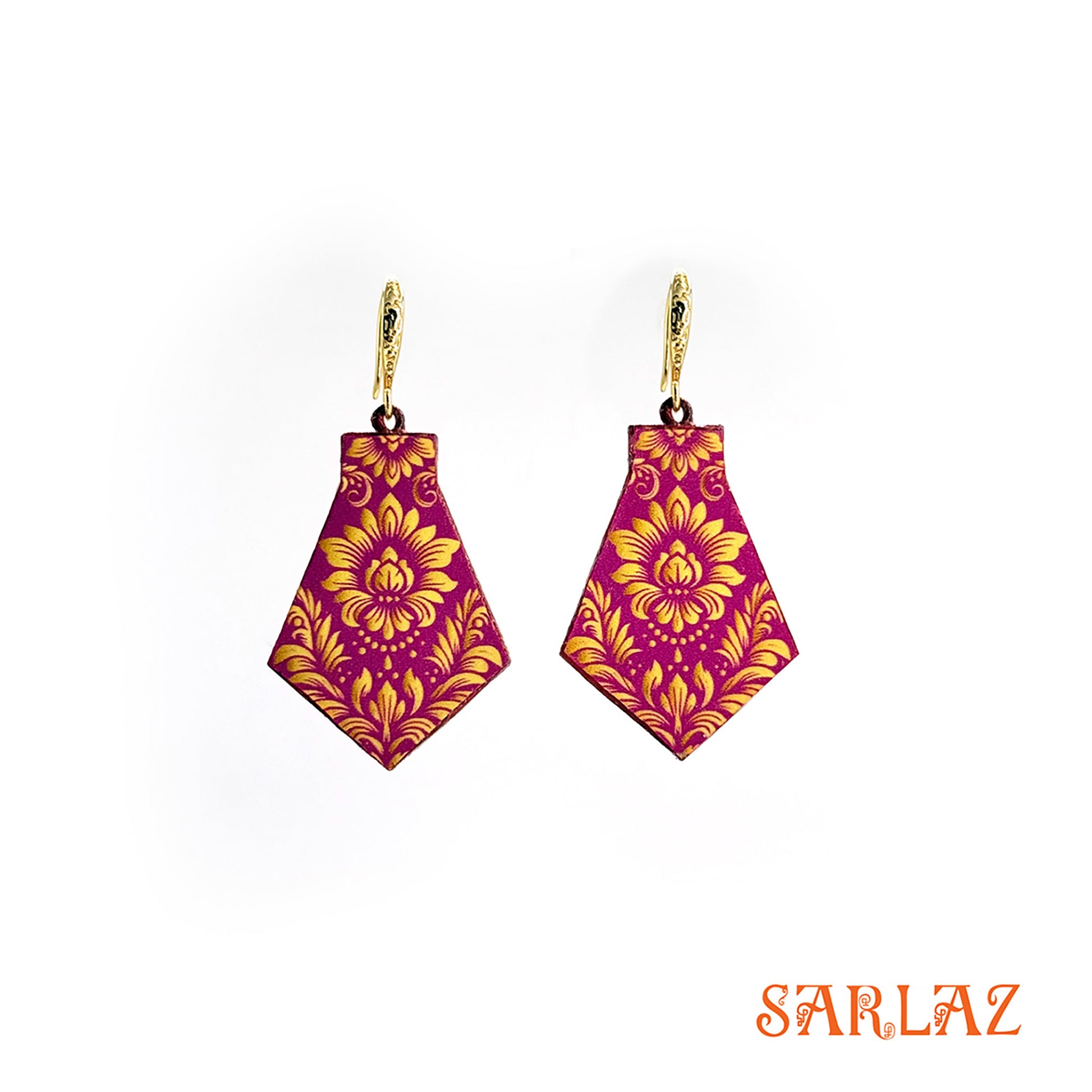 Pair of handpainted earrings on woood with fuschia and gold floral pattern,  branded 'SARLAZ'.