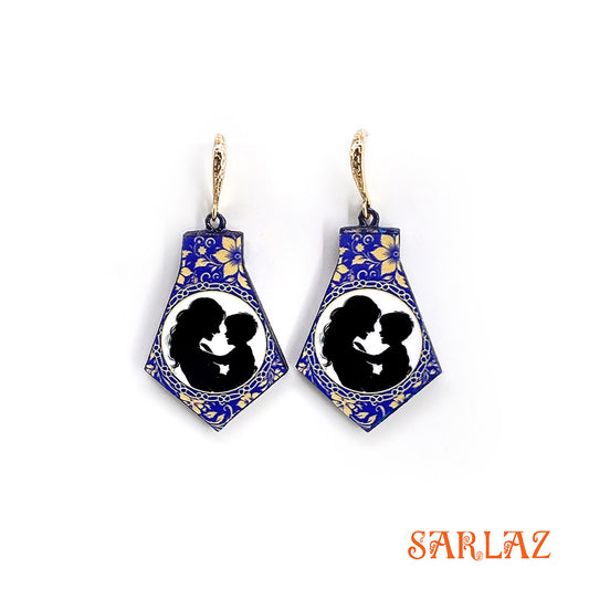 Pair of earrings with blue and gold design featuring a silhouette of a mother and her son, branded 'SARLAZ'.