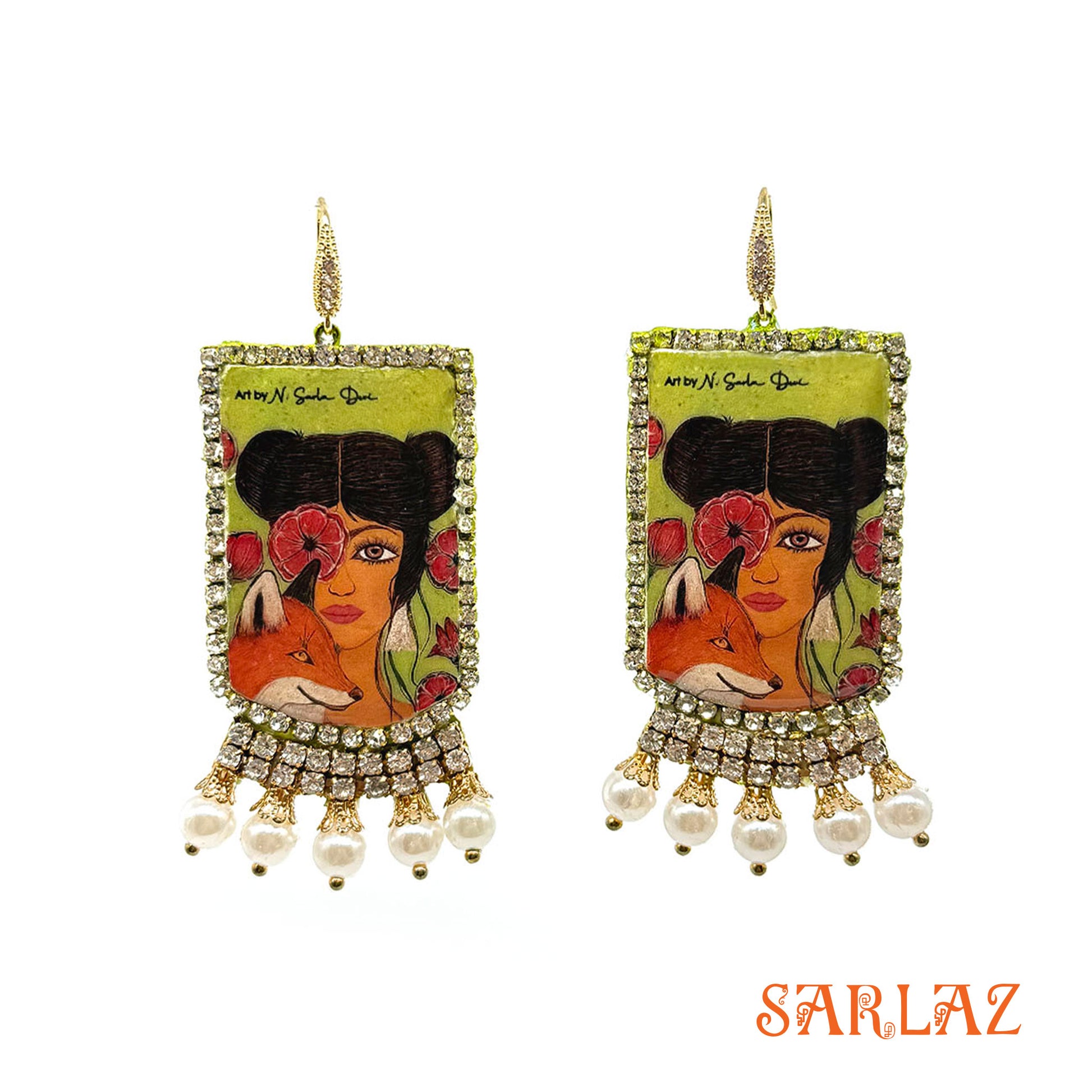 Pair of earrings of a Fox and woman with artistic design and pearl embellishments on a white background, featuring the brand 'SARLAZ'.