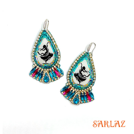 Within each turquoise teardrop, a dancing figure celebrates pure liberation by SARLAZ