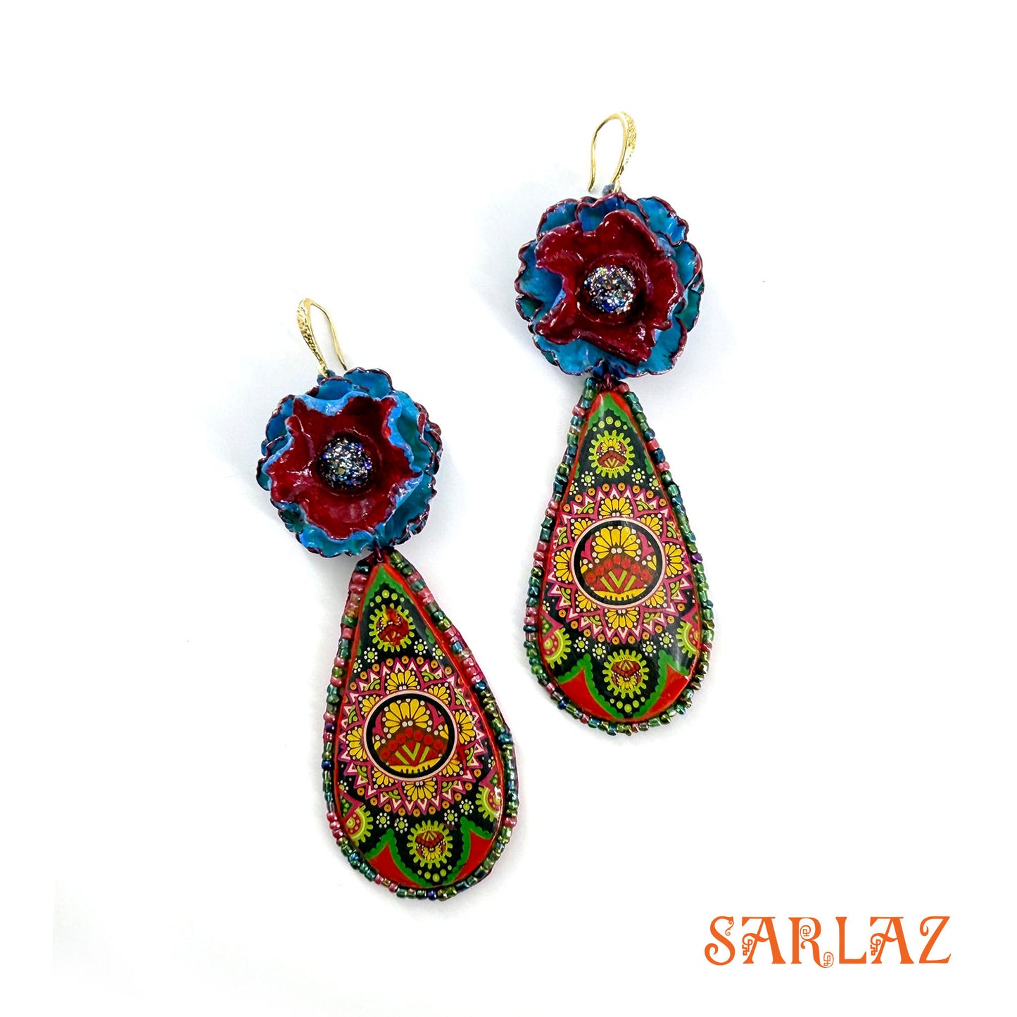 Colorful floral earrings with intricate designs on a white background, branded 'SARLAZ'.