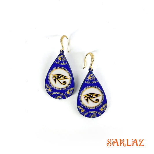 Teardrop-shaped earrings with eye design on a blue background, branded 'SARLAZ'.