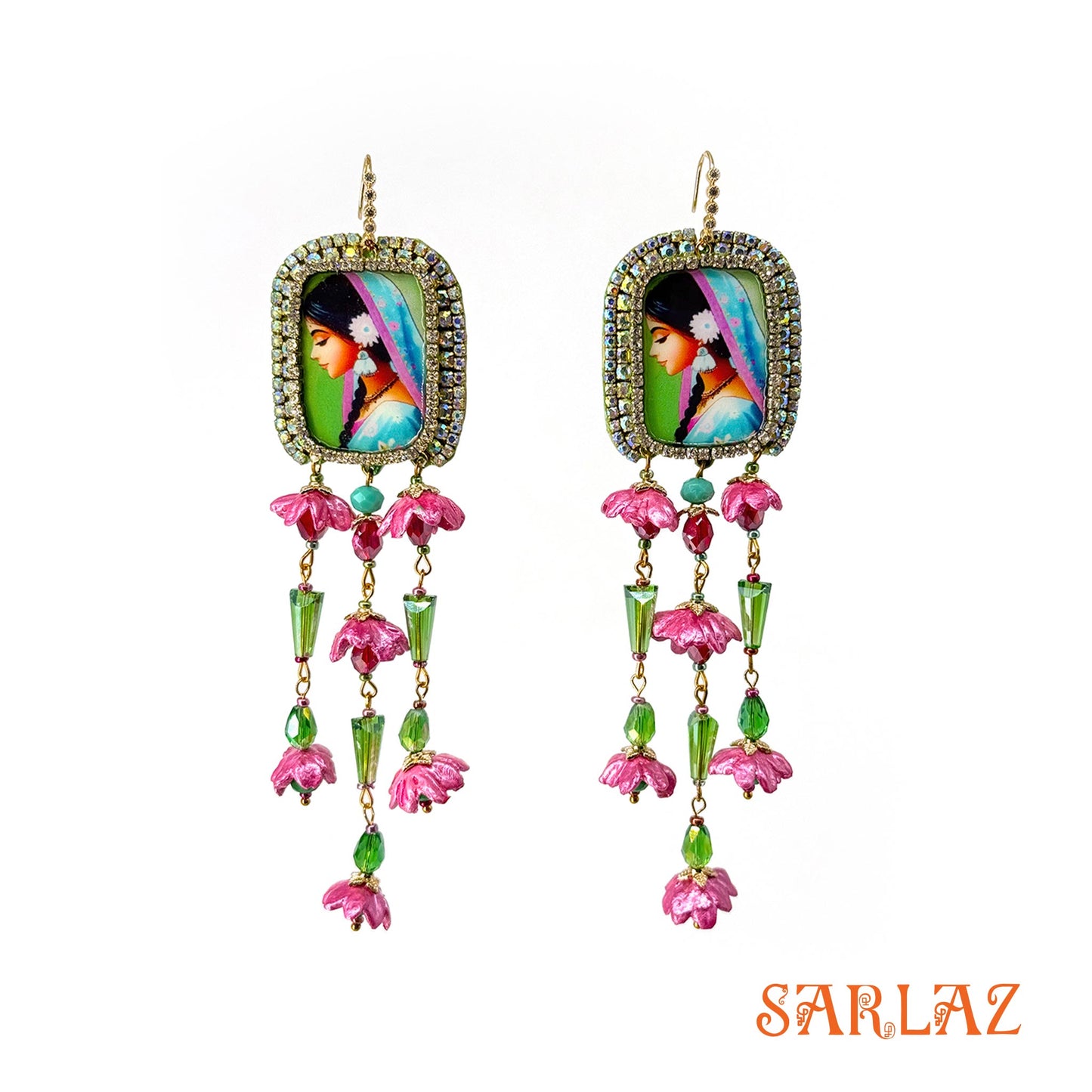 Colourful earrings with a woman portrait and floral designs and 'SARLAZ' brand logo on a white background