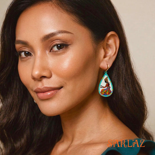 Woman wearing a colorful earring with a neutral background, featuring the brand 'SARLAZ'.