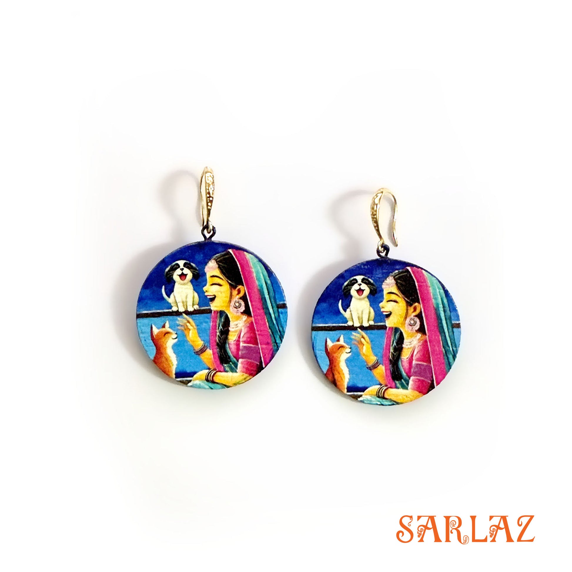 Colorful earrings with a design of a woman, dog, and cat on a white background, branded 'SARLAZ'.