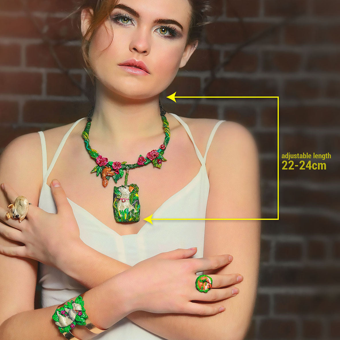 Dog Nature statement necklace, the design on the necklace captures the happy moment of a dog admiring a bird in the garden. A design by SARLAZ