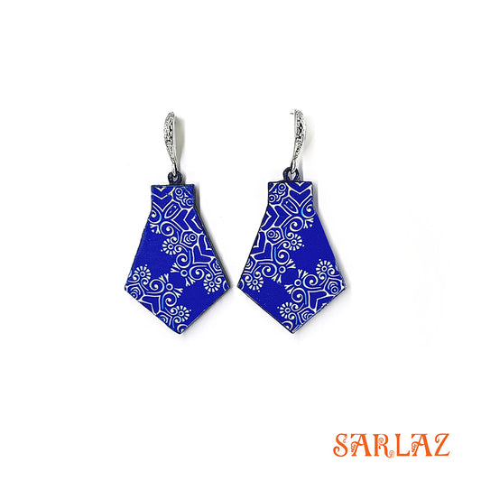 Blue geometric patterned earrings with silver hooks on a white background, branded 'SARLAZ'.