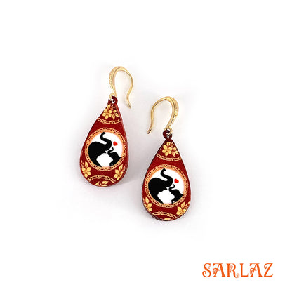 Teardrop-shaped earrings with elephant and her calf design on a white background, featuring the brand 'SARLAZ'.