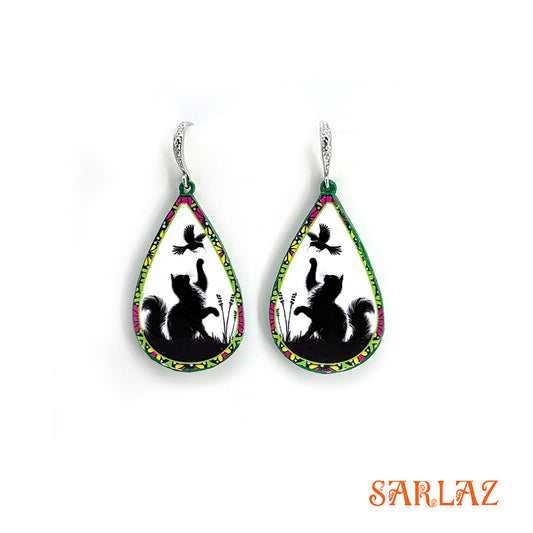 Teardrop-shaped earrings with cat and bird design on a white background, featuring the brand 'SARLAZ'.